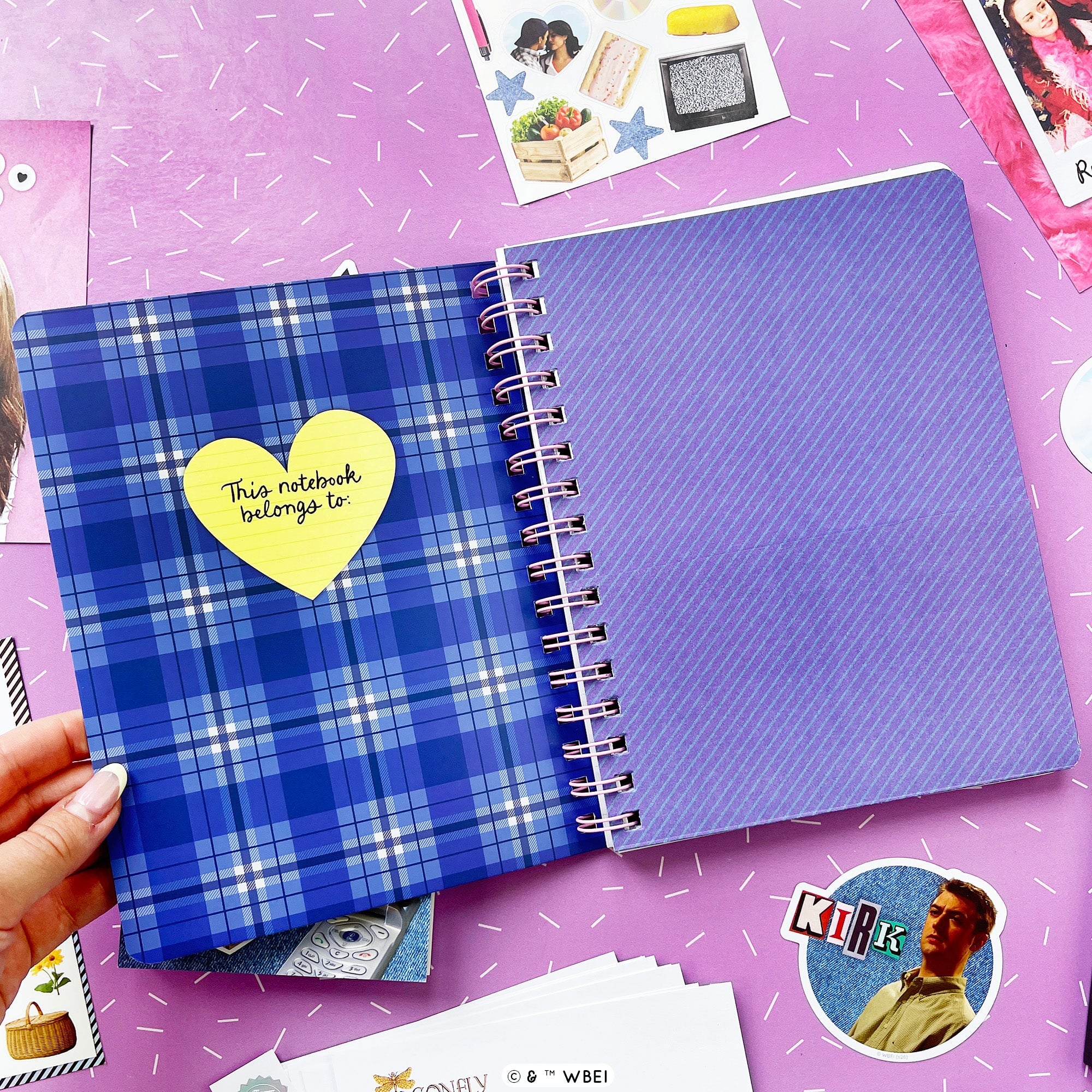 Inside pages of a notebook showing off a pocket page and a plaid inside front cover. 
