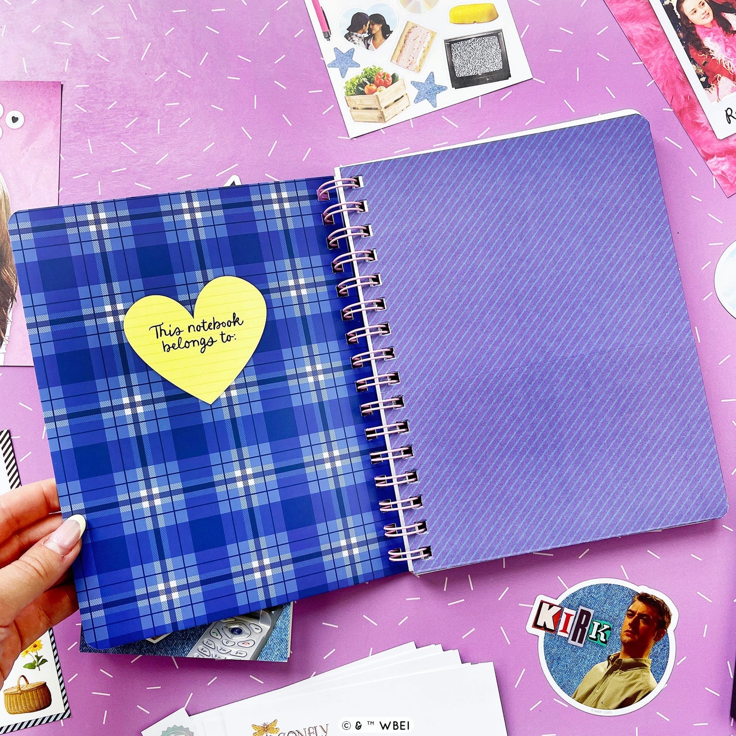 Inside pages of a notebook showing off a pocket page and a plaid inside front cover. 