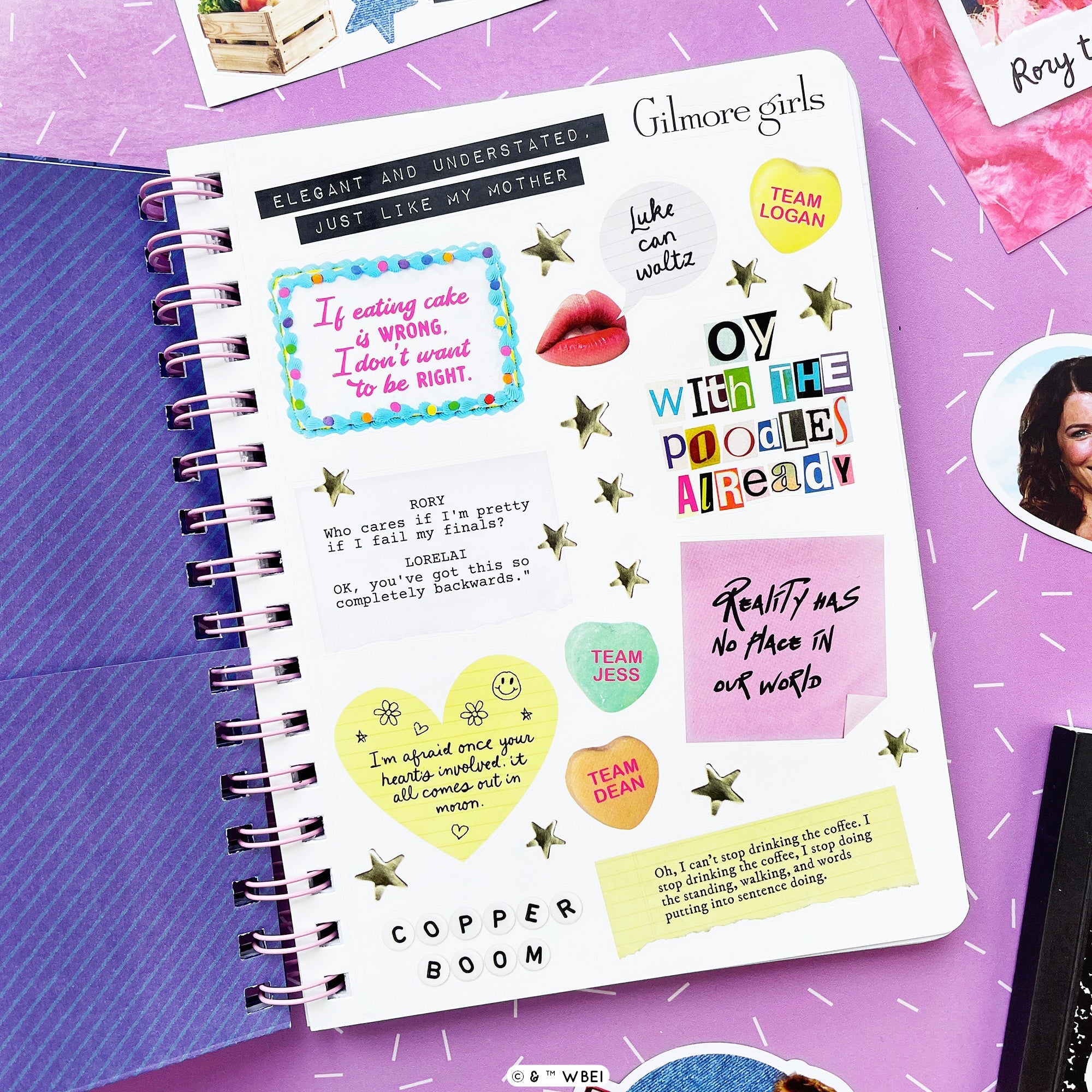 A spiral-bound notebook,  showing inside sticker sheet with colorful handwritten stickers, and quote boxes, displayed on a purple surface next to a blue planner and other stationery items.